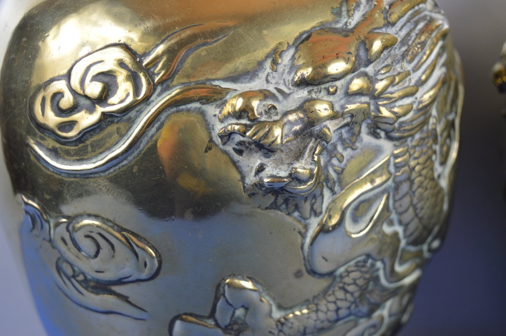 A matching pair of heavy polished gold gilt bronze baluster vases featuring carved high-relief dragons amid swirling cloud motifs. View XI
