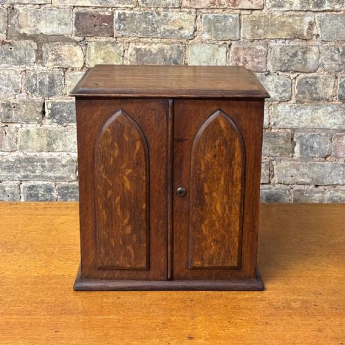 ANTIQUE OAK TABLE CABINET WITH GOTHIC PANEL DOORS