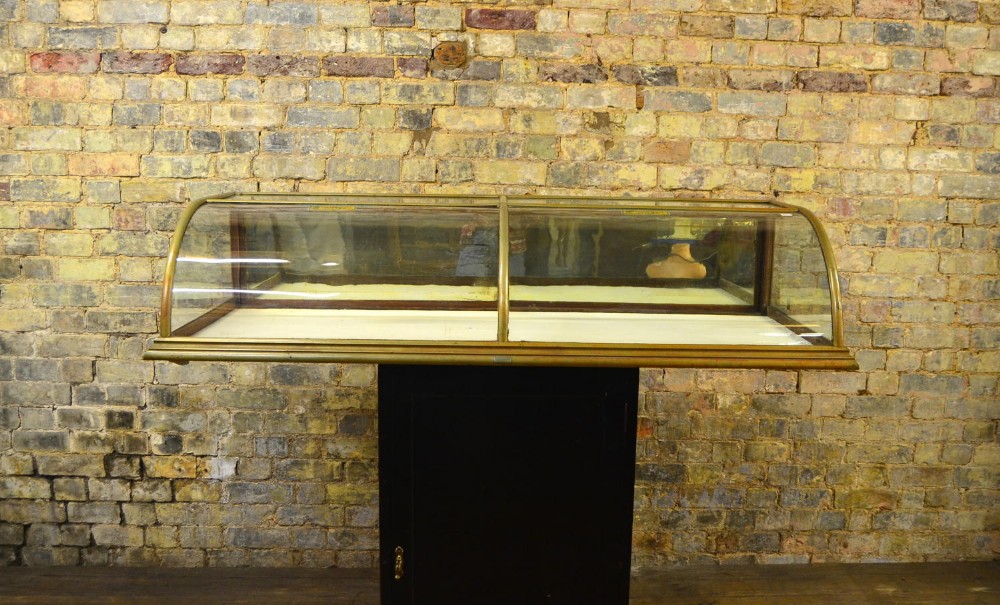 Antique Nickel Bow Glass Counter Top Cabinet