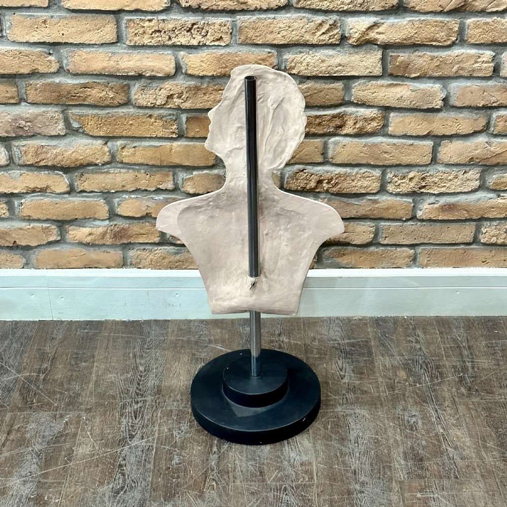 An Art Deco female mannequin bust featuring sculpted blonde waved hair, painted makeup, and a black circular stand. View II