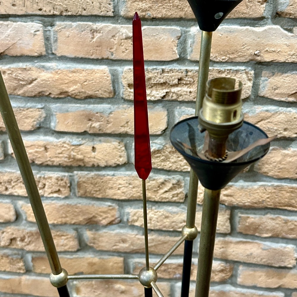 A mid-century French modernist floor lamp featuring three angled black and brass stems terminating in cone-shaped socket holders set upon a circular base. View II