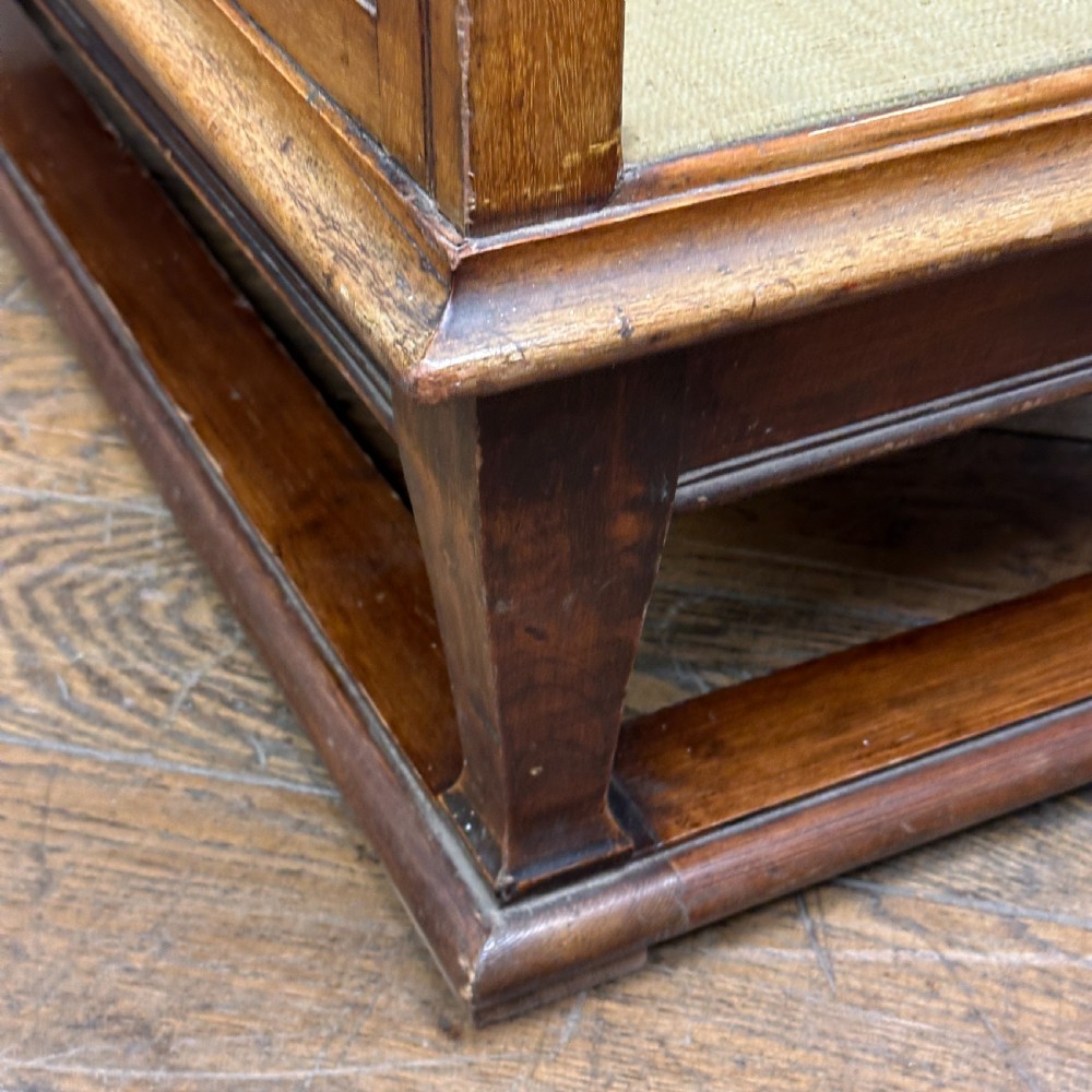 A tall glazed mahogany shop display cabinet featuring double glass doors, side glass panels, and internal metal shelf brackets on a plinth base. View VI