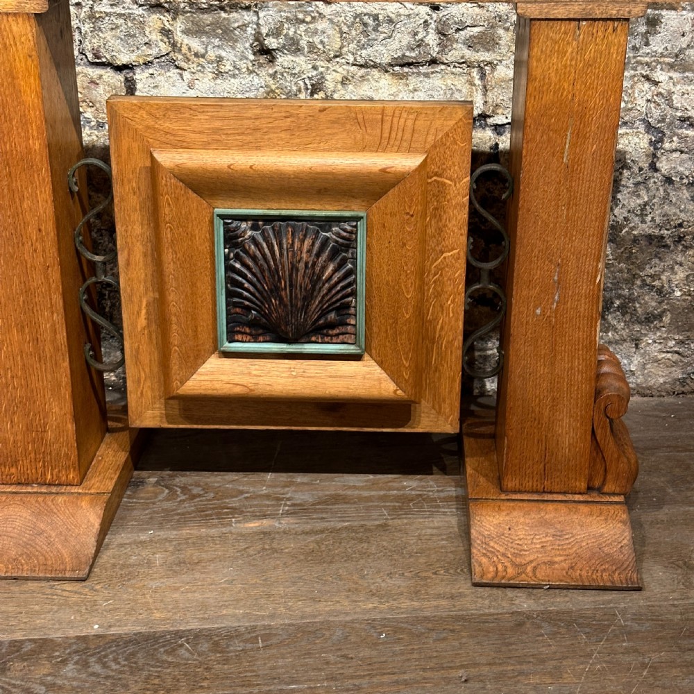 A large rectangular French Art Deco dining table featuring a geometric parquetry top and sturdy carved supports. View VI