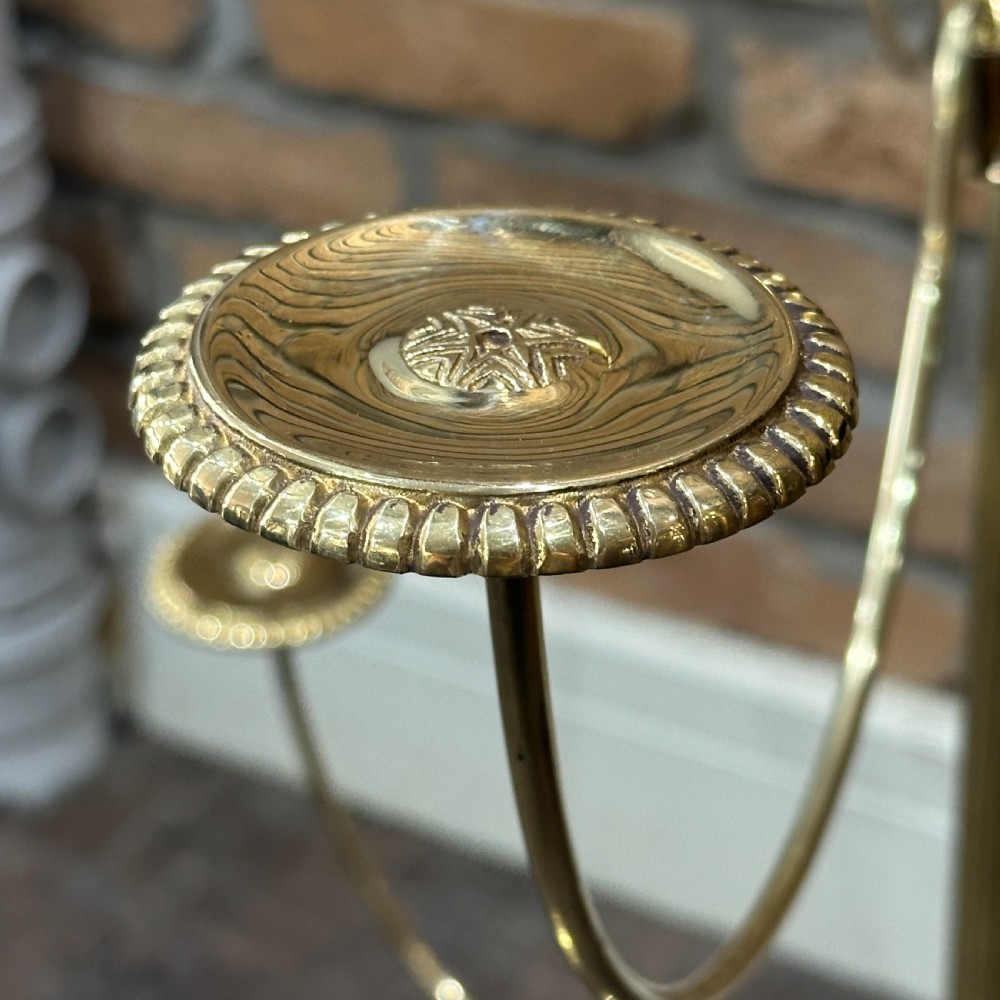 A polished brass multi-arm countertop hat stand featuring a reeded central column, six curved display arms, and a weighted octagonal base. View III