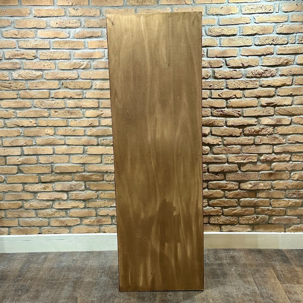 A tall, refurbished 1930s oak haberdashery cabinet featuring multiple glass-fronted drawers and brass hardware against a brick wall. View IV