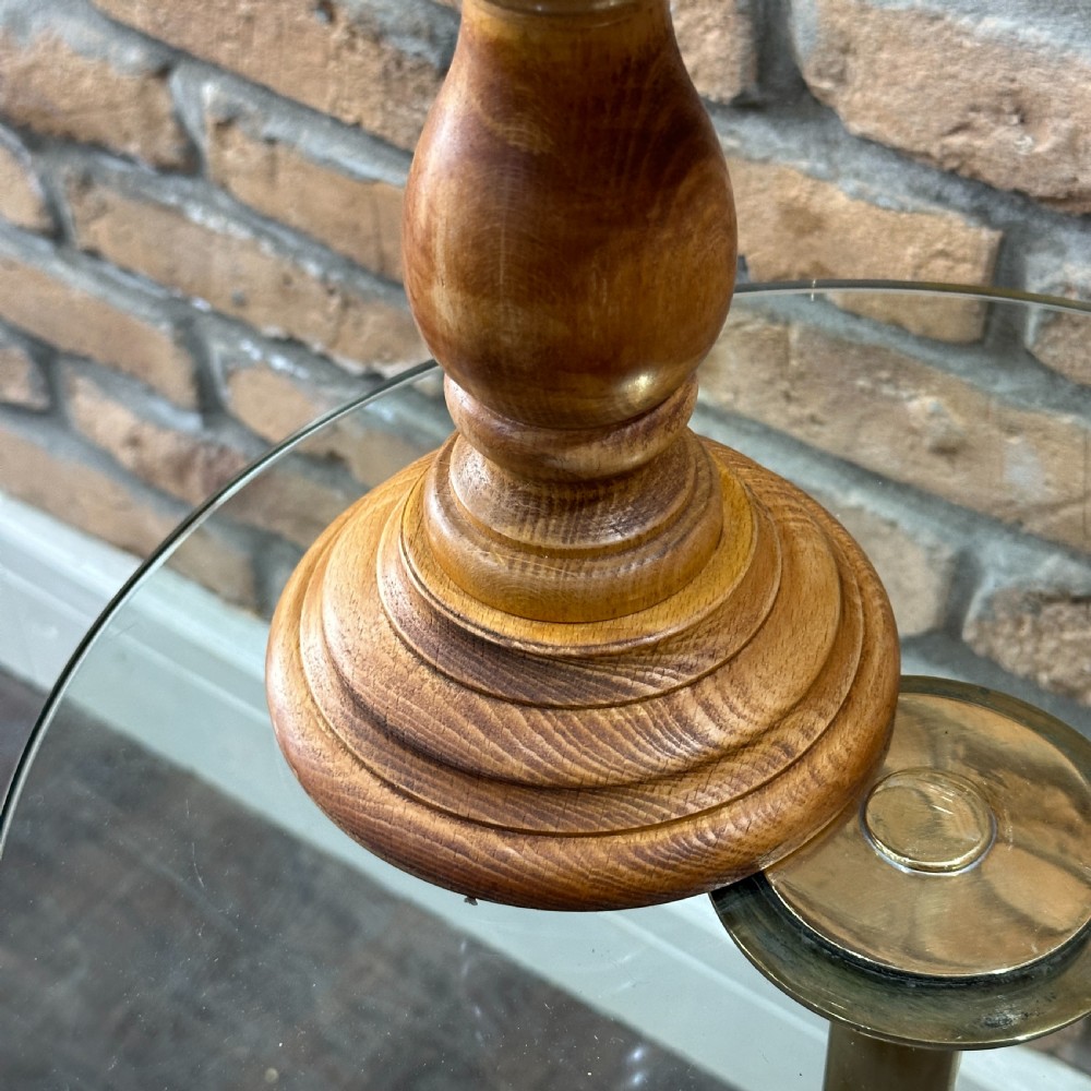 A solid turned beechwood hat block mounted on a turned pedestal and circular stepped base. View II