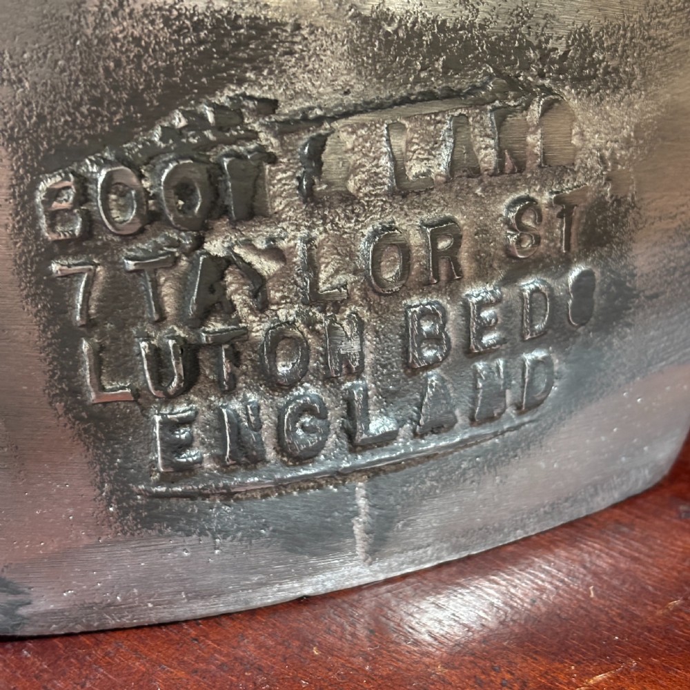 A polished silver aluminium two-piece milliners hat block mould stamped with maker details. View III