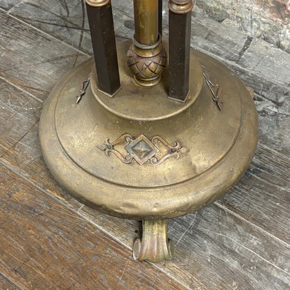 An antique brass floor lamp stand featuring spiral barley twist supports, a central column, and a decorative domed base resting on scrolled feet. View II
