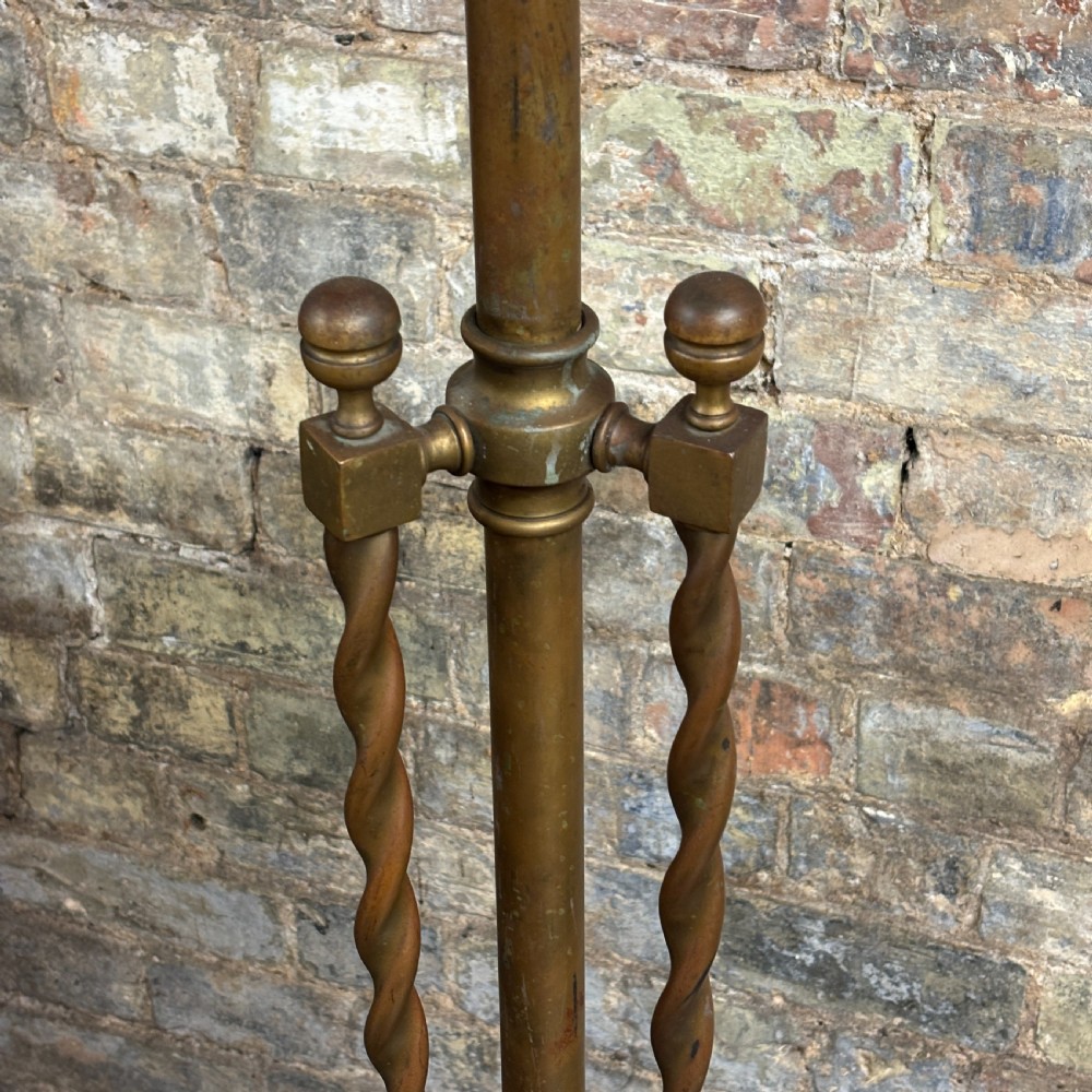 An antique brass floor lamp stand featuring spiral barley twist supports, a central column, and a decorative domed base resting on scrolled feet. View IV