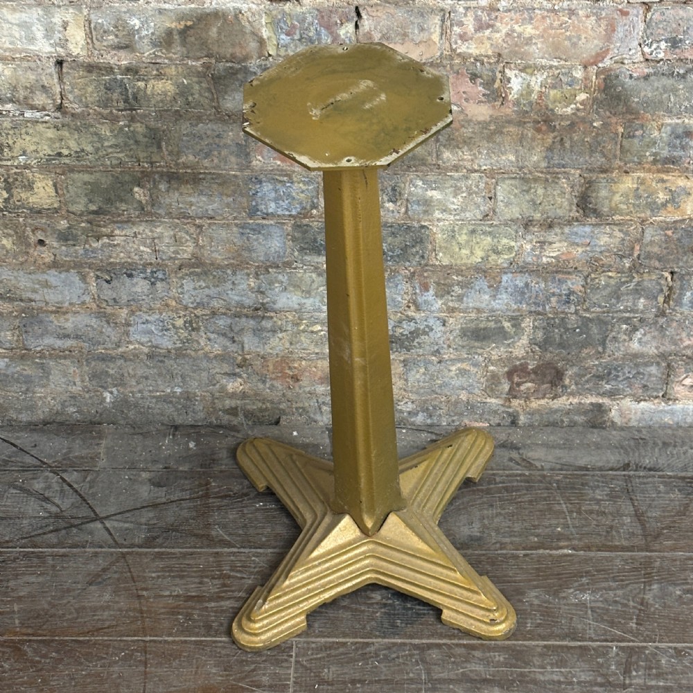 A gold-painted cast iron table base featuring a four-star stepped base, a central tapered column, and an octagonal top mounting plate. View II