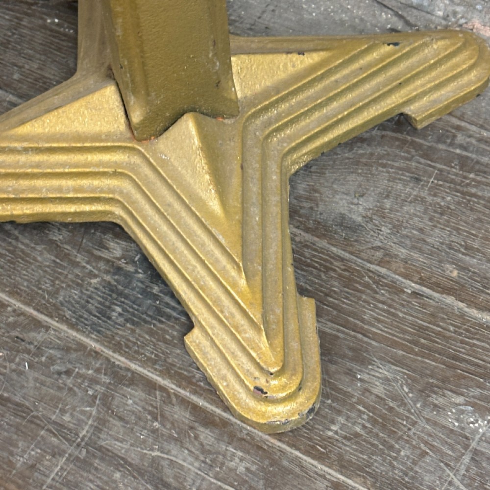 A gold-painted cast iron table base featuring a four-star stepped base, a central tapered column, and an octagonal top mounting plate. View III