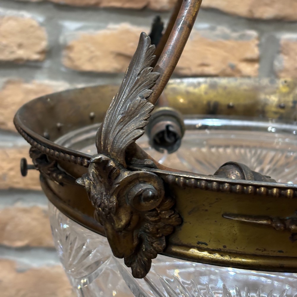 A late Victorian ceiling pendant light featuring a cut glass bowl suspended by three curved bronze rods attached to a central top ring. View IV