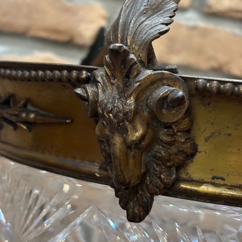 A late Victorian ceiling pendant light featuring a cut glass bowl suspended by three curved bronze rods attached to a central top ring. View V