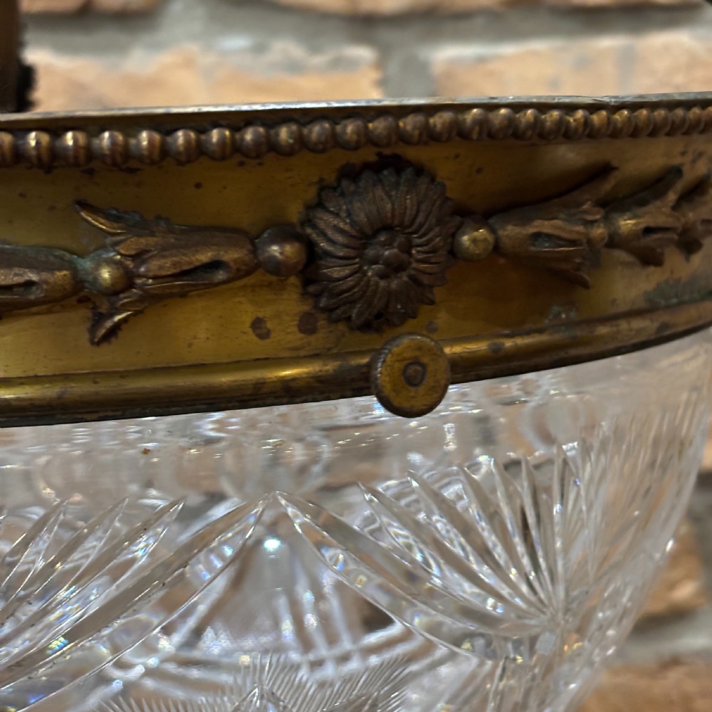 A late Victorian ceiling pendant light featuring a cut glass bowl suspended by three curved bronze rods attached to a central top ring. View VII