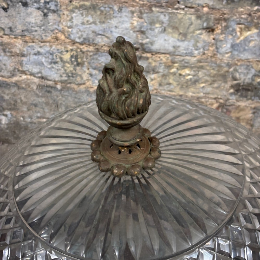 An early 1900s dome-shaped cut glass light fitting featuring diamond lattice pattern glass and a patinated bronze mount with floral swag ornamentation. View III