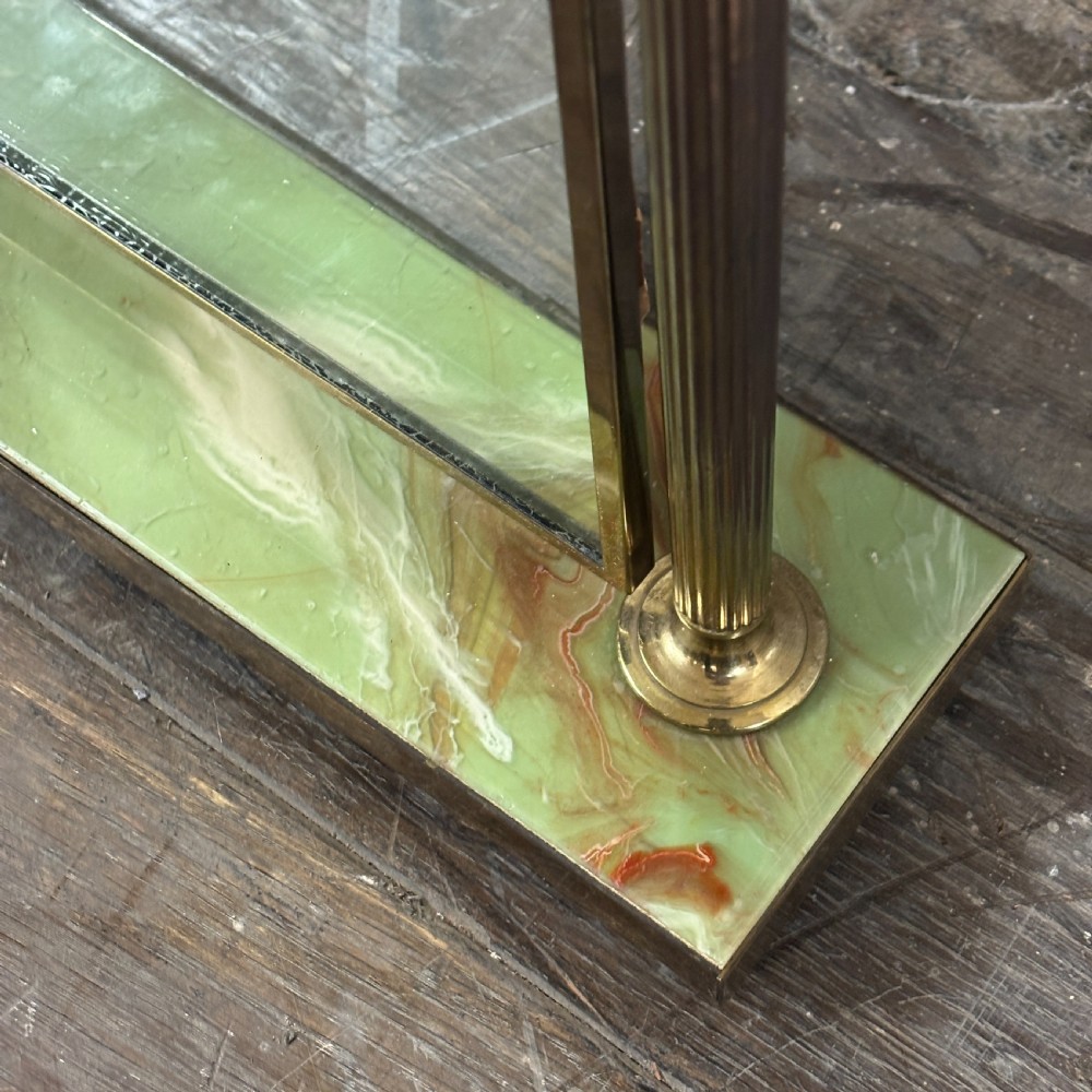 An Art Deco tabletop dressing mirror featuring a rectangular glass panel, fluted brass support columns, and a rectangular green onyx base. View II