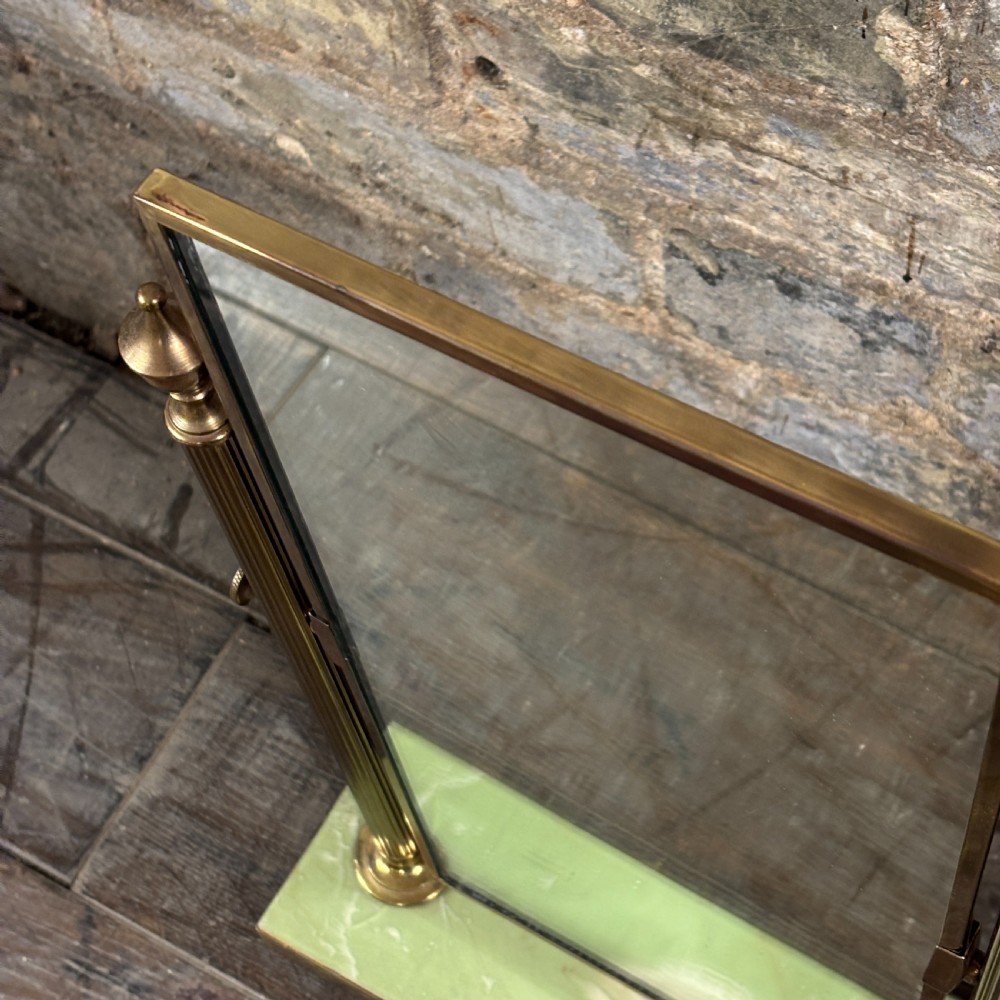 An Art Deco tabletop dressing mirror featuring a rectangular glass panel, fluted brass support columns, and a rectangular green onyx base. View III