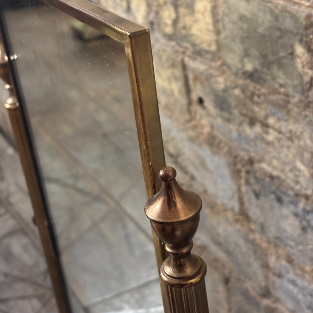 An Art Deco tabletop dressing mirror featuring a rectangular glass panel, fluted brass support columns, and a rectangular green onyx base. View V