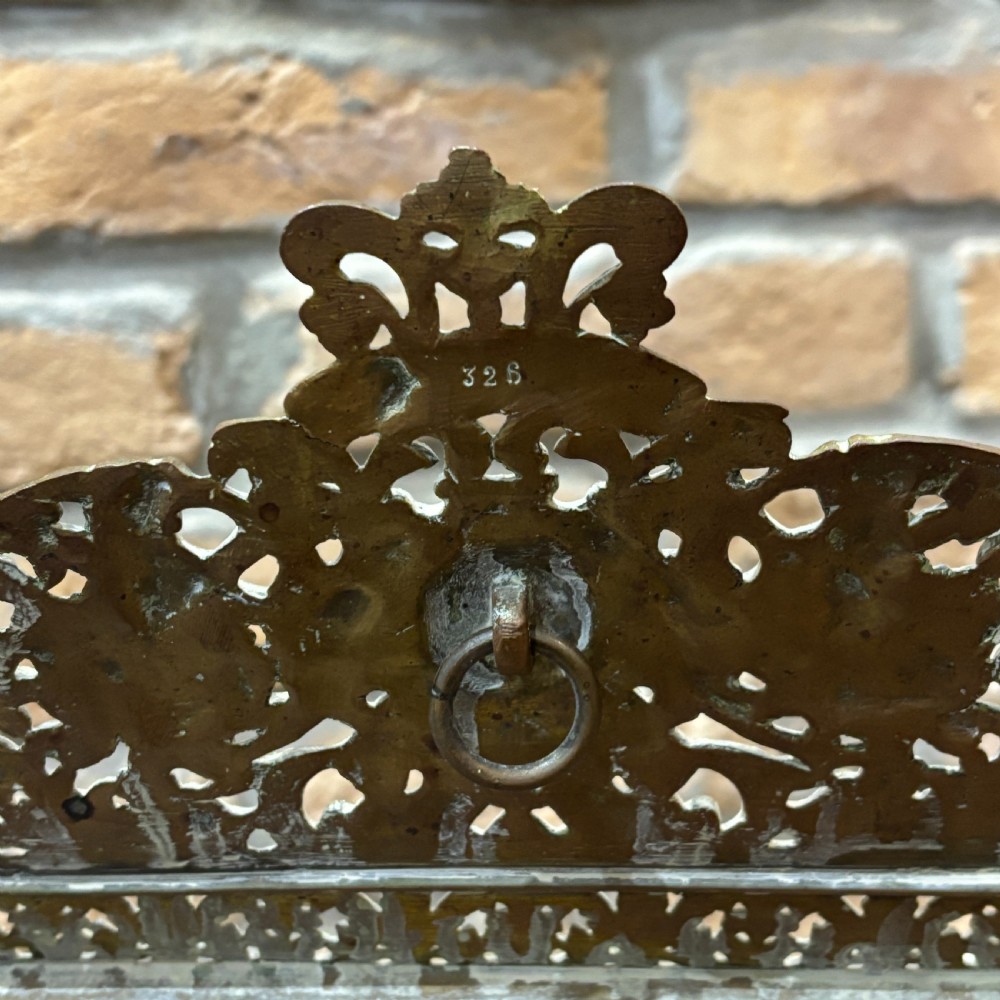 An ornate late nineteenth-century French brass table mirror featuring a crowned crest, relief scrollwork border, and a rectangular bevelled glass plate. View IV
