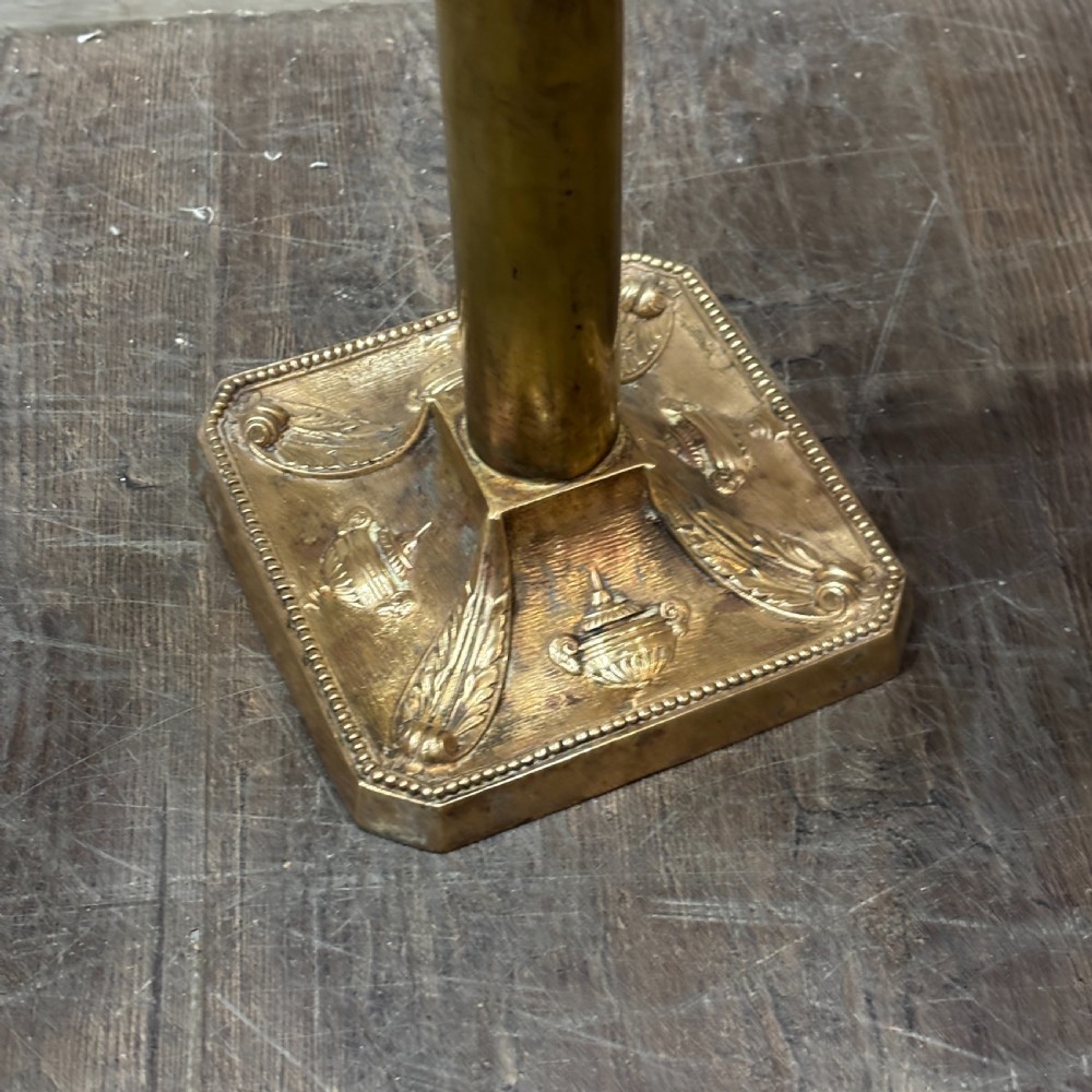 A pair of dark bronze Neoclassical table lamps featuring merman figures supporting twin cornucopia arms on square bases. View II