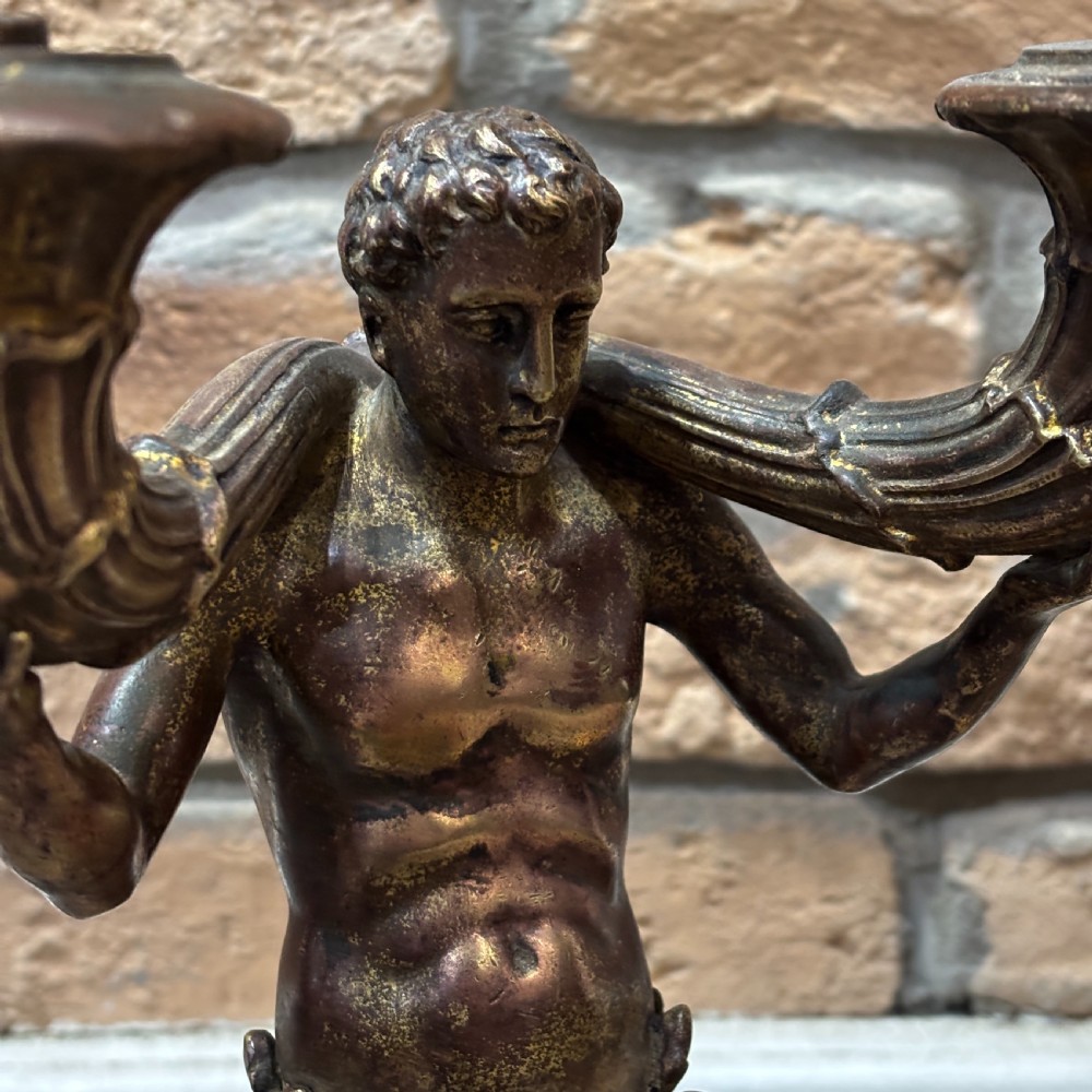 A pair of dark bronze Neoclassical table lamps featuring merman figures supporting twin cornucopia arms on square bases. View III