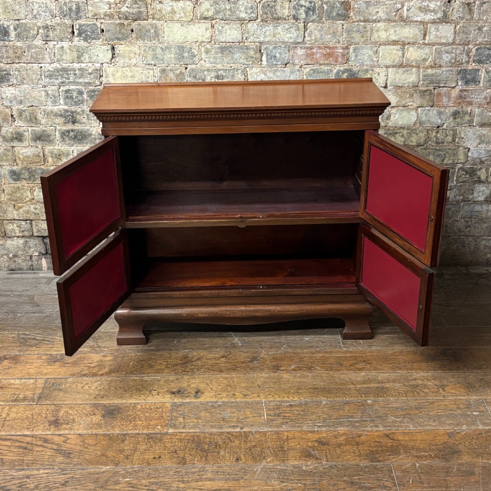 An early 20th-century mahogany office cabinet featuring four maroon panels with gold hand-lettering reading Farrer and Co Barristers Solicitors. View V