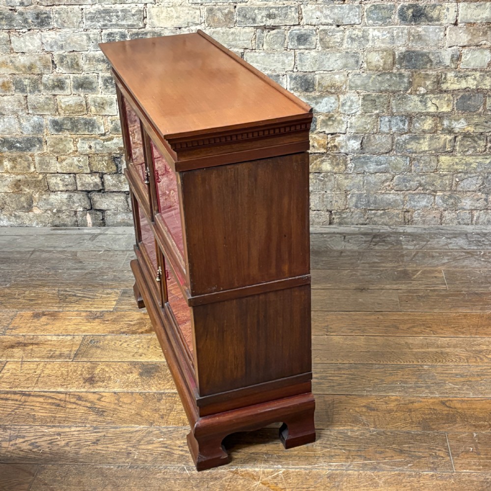 An early 20th-century mahogany office cabinet featuring four maroon panels with gold hand-lettering reading Farrer and Co Barristers Solicitors. View VI