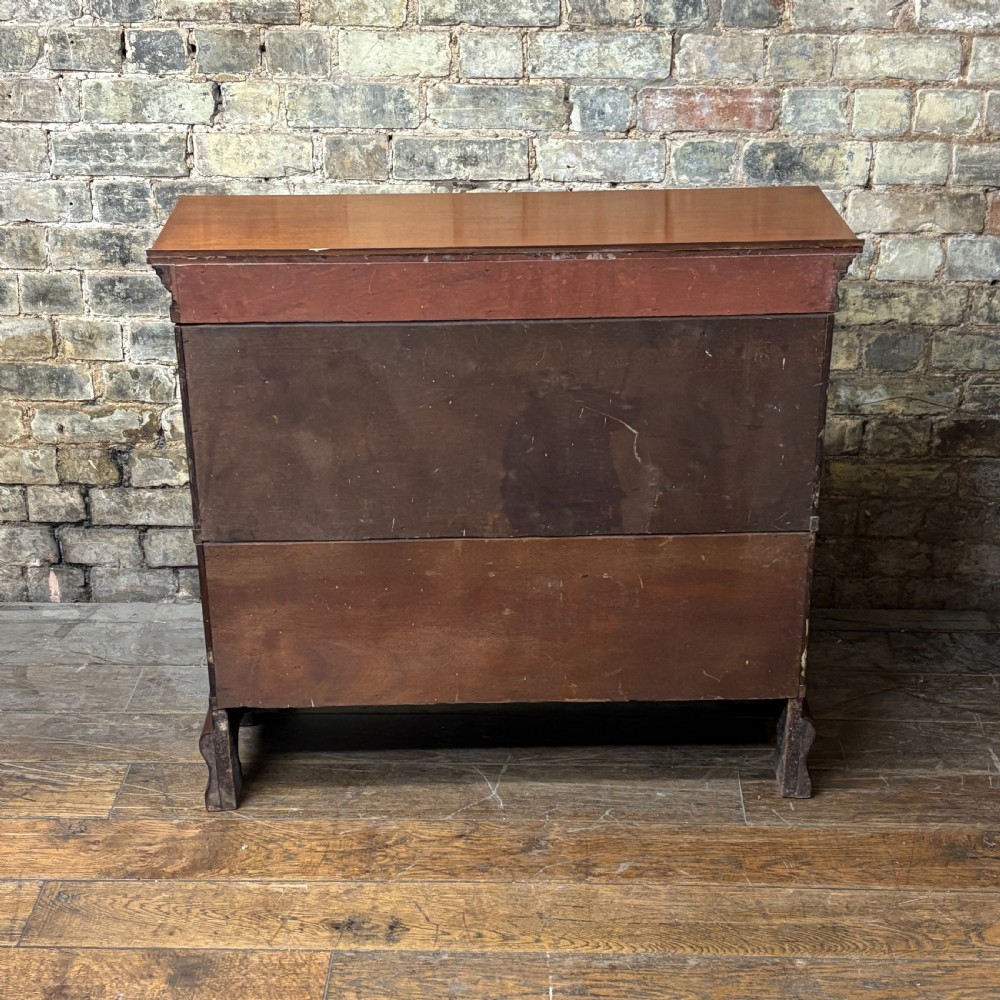 An early 20th-century mahogany office cabinet featuring four maroon panels with gold hand-lettering reading Farrer and Co Barristers Solicitors. View VII
