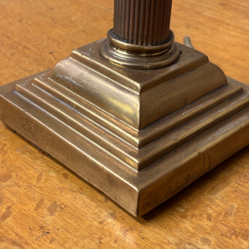 A cast brass table lamp base designed in the form of a fluted Corinthian column on a stepped square plinth. View III