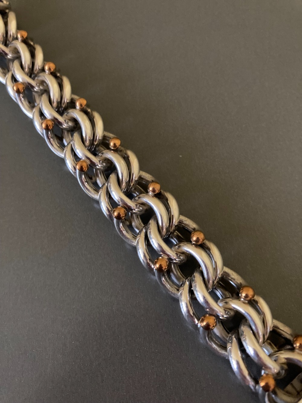 An intricate mid-century Danish silver link bracelet featuring interlocking metalwork and a toggle clasp. View II