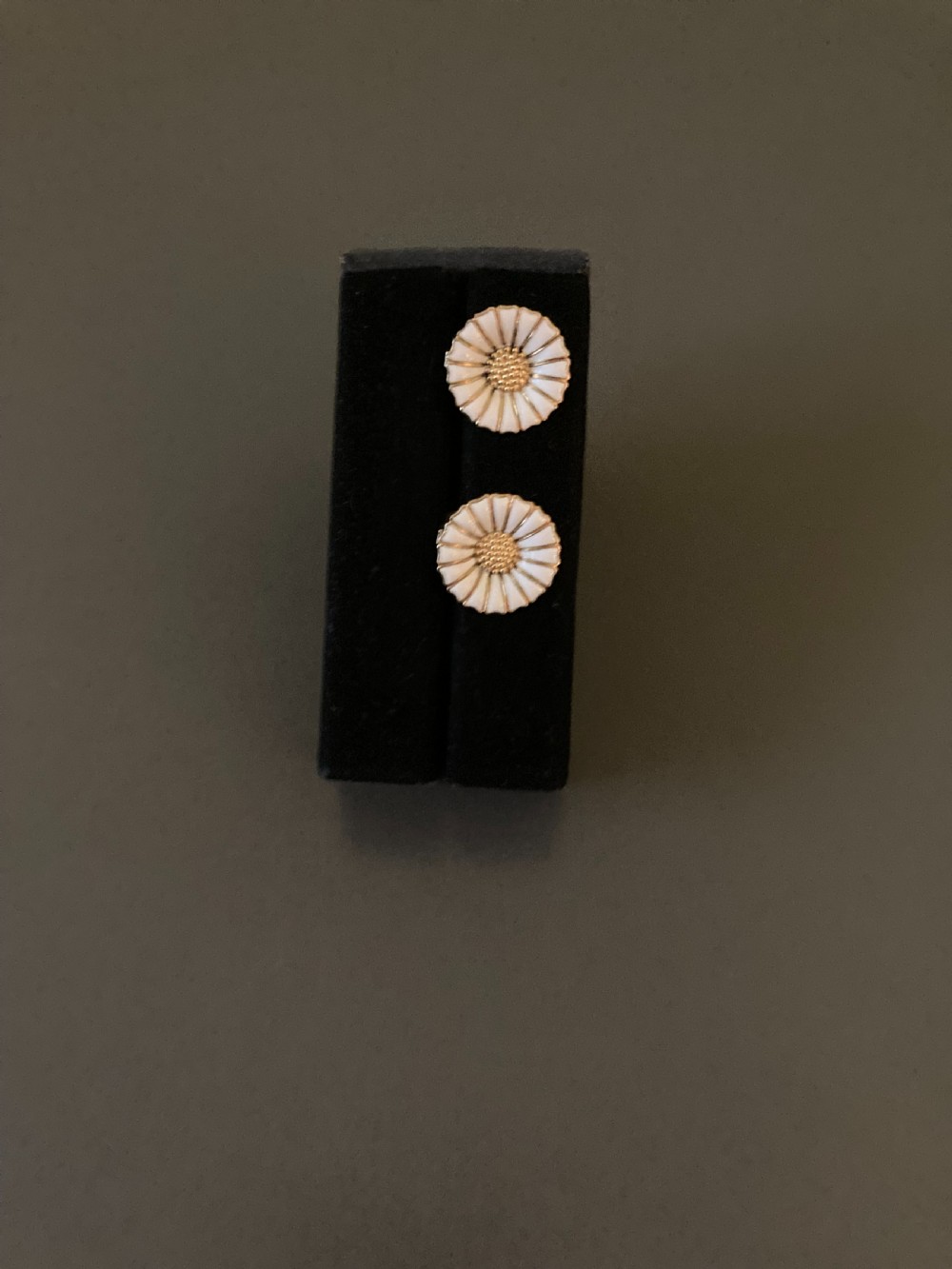 A pair of vintage Danish silver gilt daisy earrings featuring white enamelled petals and a textured gold centre. View II