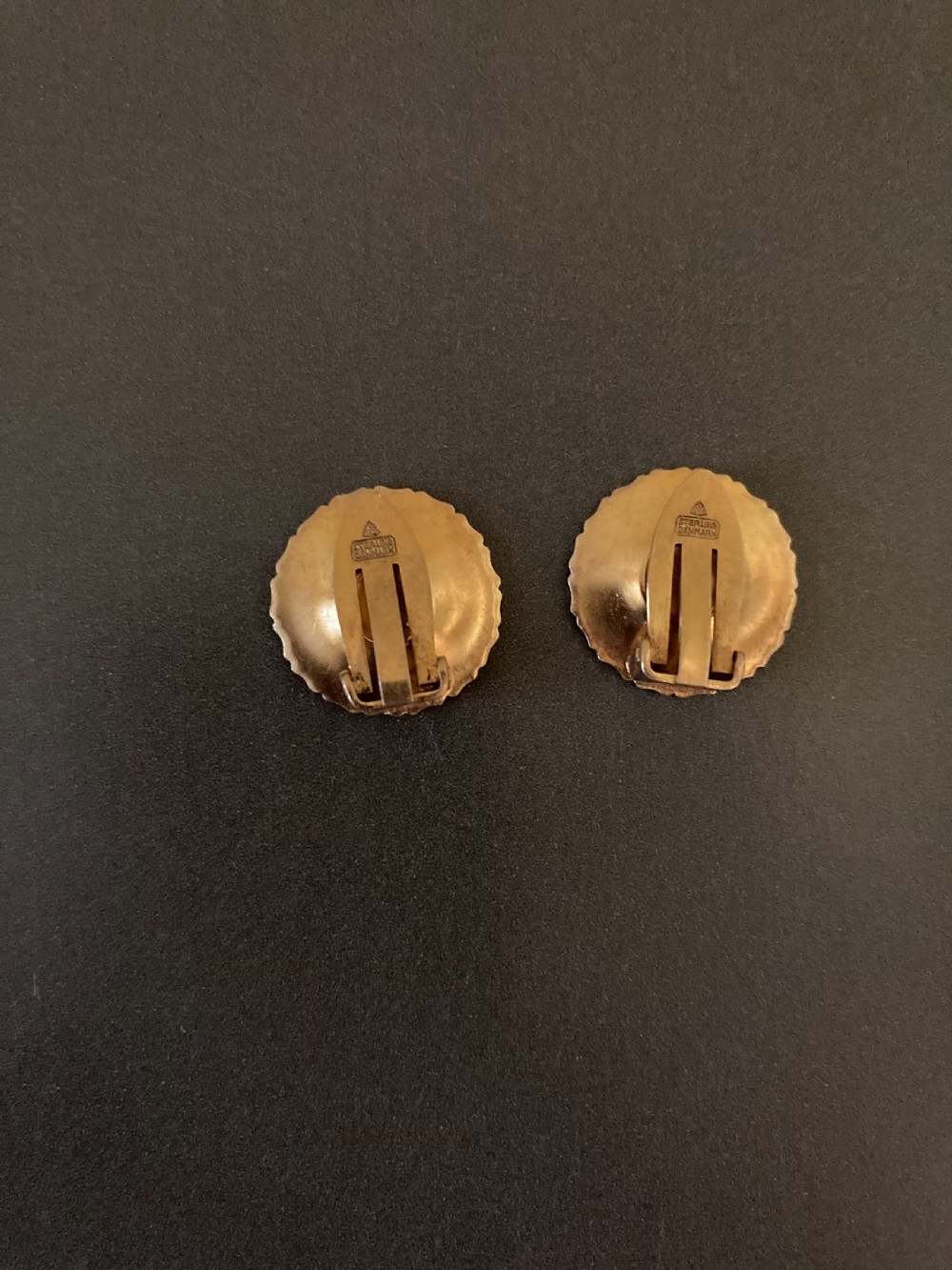 A pair of vintage Danish silver gilt daisy earrings featuring white enamelled petals and a textured gold centre. View III