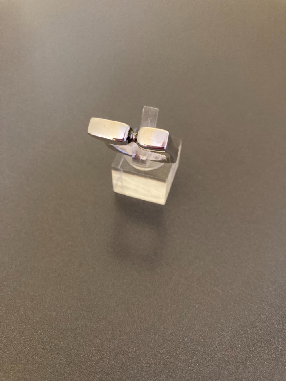 A sculptural 1960s Danish sterling silver ring featuring a geometric architectural design with a polished finish. View II