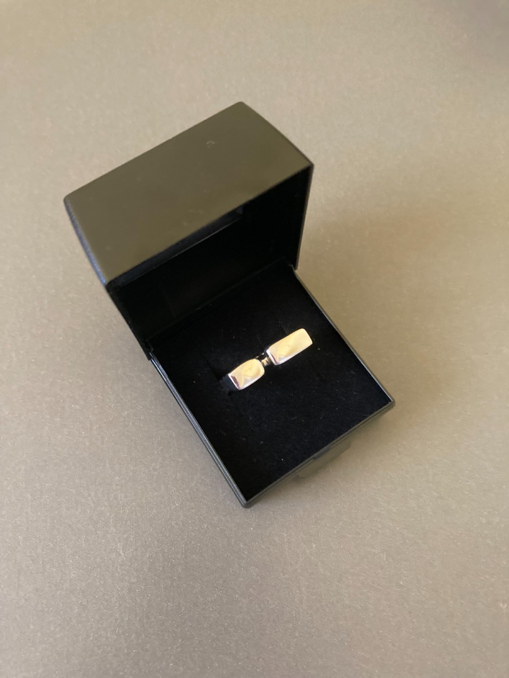 A sculptural 1960s Danish sterling silver ring featuring a geometric architectural design with a polished finish. View V