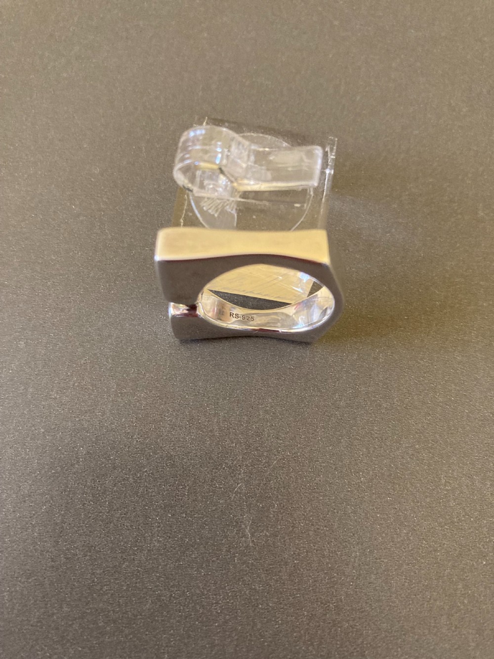 A sculptural 1960s Danish sterling silver ring featuring a geometric architectural design with a polished finish. View VII