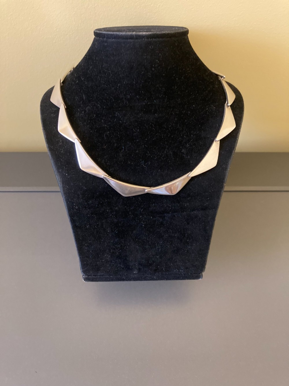 A Georg Jensen sterling silver collar necklace featuring a series of connected, angular triangular peak-shaped links. View II
