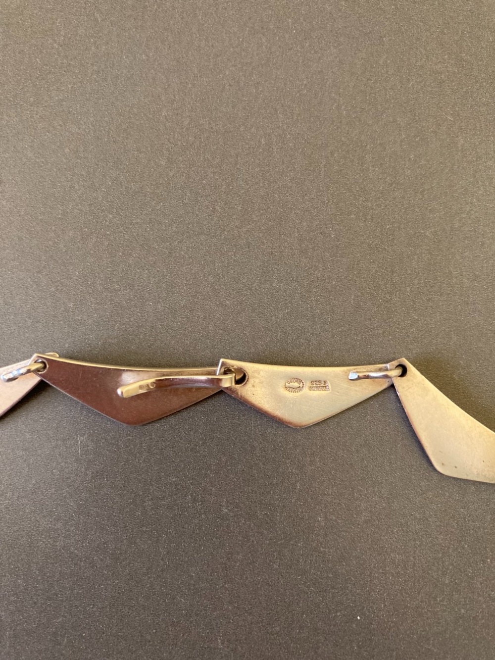 A Georg Jensen sterling silver collar necklace featuring a series of connected, angular triangular peak-shaped links. View IV