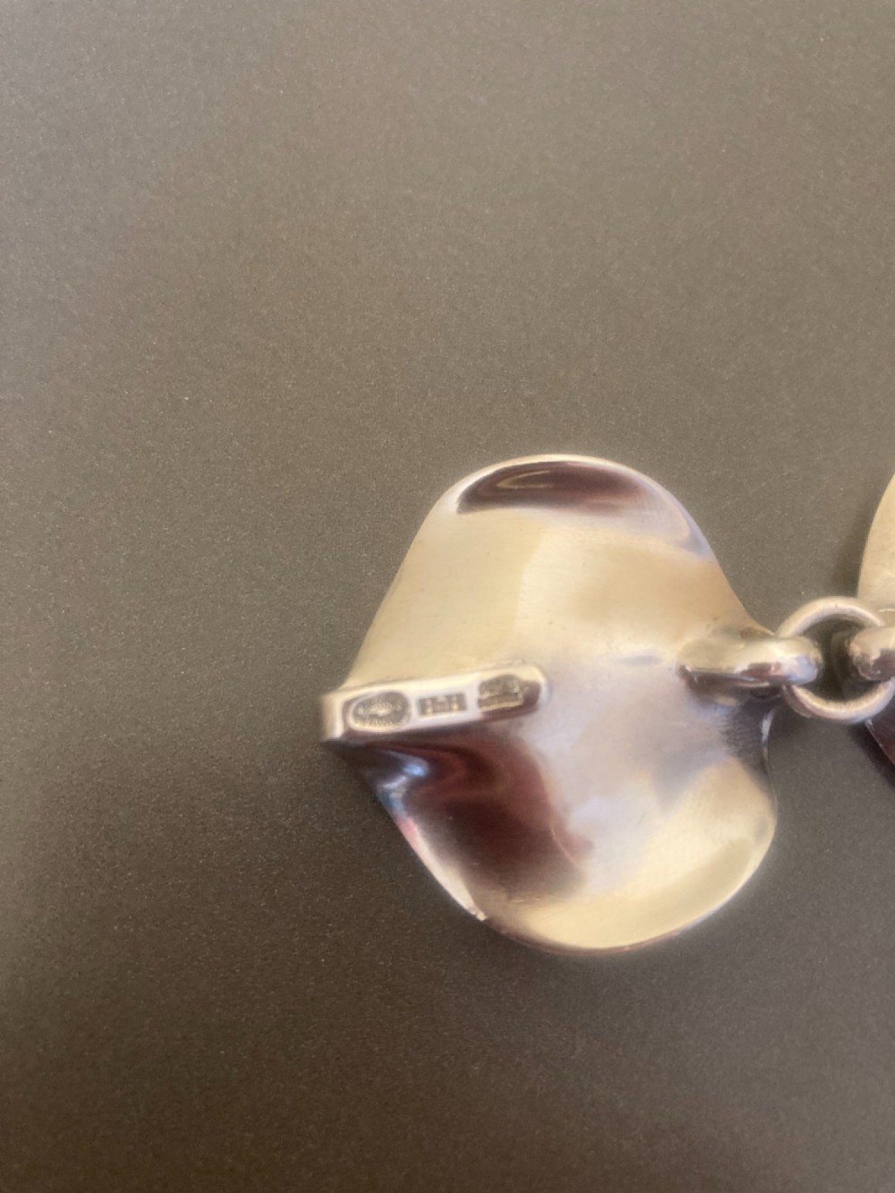 A 1960s Georg Jensen sterling silver link bracelet featuring five organic, undulating petal-formed links joined by small silver rings. View VI