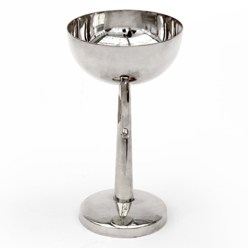 A silver-plated pedestal bonbon dish featuring a hemispherical bowl, elevated central stem, round stepped base, and two side loop handles. View III