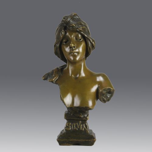 fig 1. An Art Nouveau patinated bronze bust titled Silvia, featuring a female portrait sculpture on an integrated cast base.