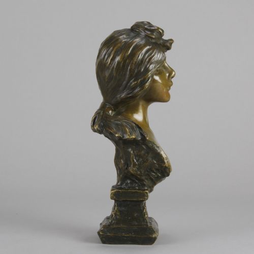 fig 2. An Art Nouveau patinated bronze bust titled Silvia, featuring a female portrait sculpture on an integrated cast base.