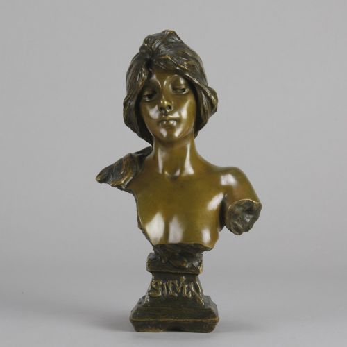 fig 3. An Art Nouveau patinated bronze bust titled Silvia, featuring a female portrait sculpture on an integrated cast base.