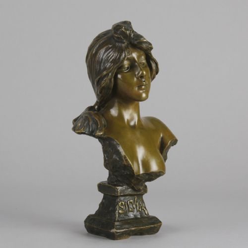 fig 5. An Art Nouveau patinated bronze bust titled Silvia, featuring a female portrait sculpture on an integrated cast base.