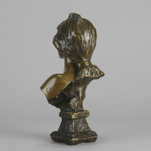 fig 7. An Art Nouveau patinated bronze bust titled Silvia, featuring a female portrait sculpture on an integrated cast base.