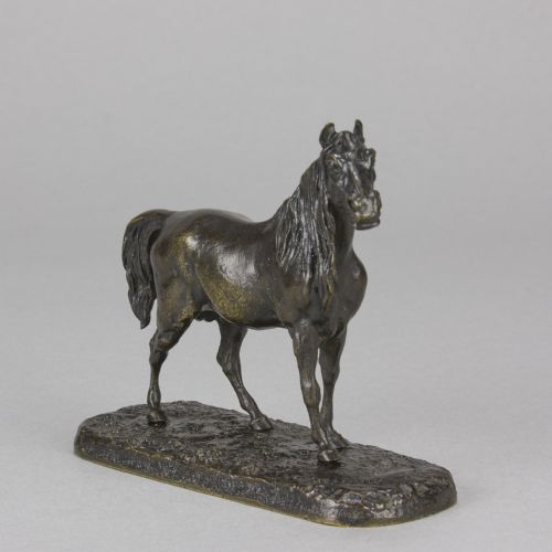fig 3. A nineteenth-century dark patinated bronze sculpture depicting a standing Arabian horse on a textured ground base.
