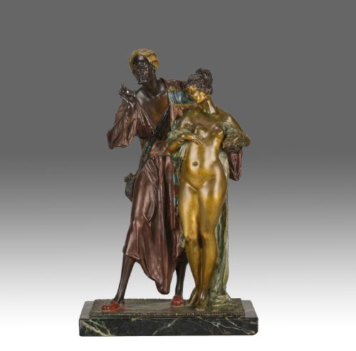 fig 1. An early 20th-century cold-painted bronze Orientalist figure group mounted on a rectangular dark green veined marble base.