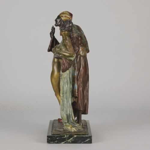 fig 2. An early 20th-century cold-painted bronze Orientalist figure group mounted on a rectangular dark green veined marble base.