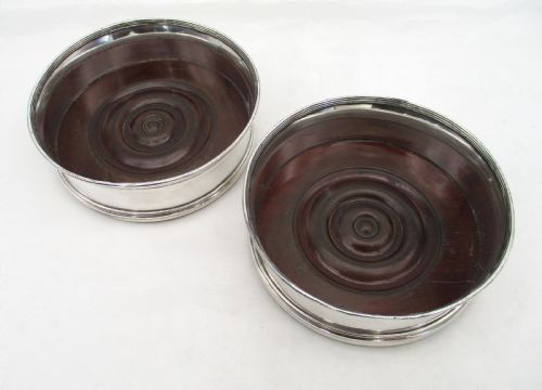 FINE PAIR OF OLD SHEFFIELD PLATED REGENCY COASTERS WITH TURNED MAHOGANY BASES - ADDITIONAL PHOTO 1
