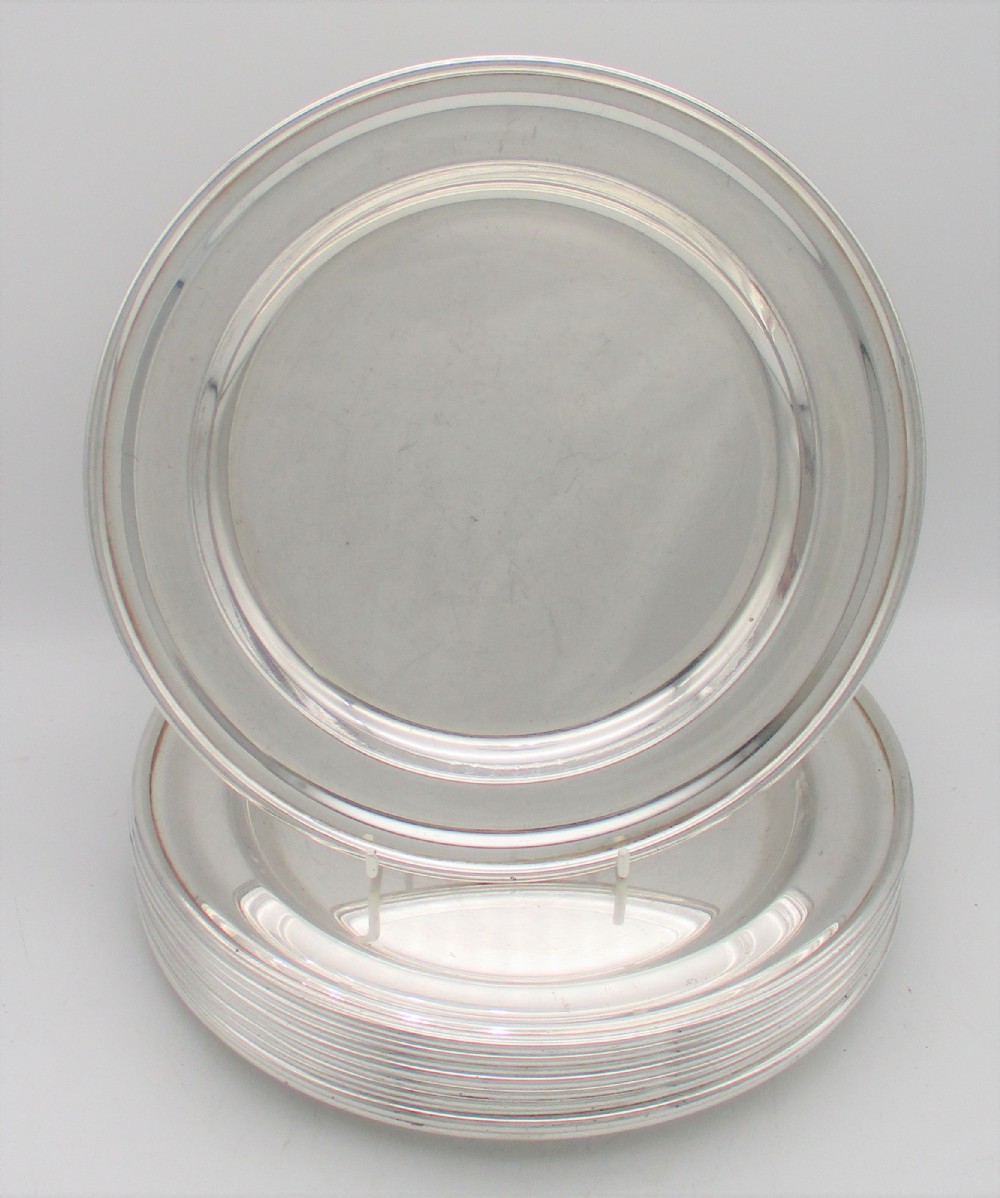 A Rare Set of 10 Silver Plated Dinner Plates