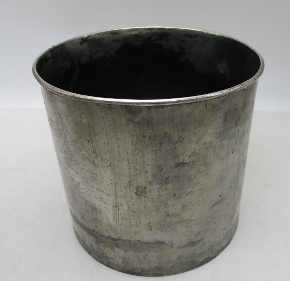 An urn-shaped Old Sheffield Plate wine cooler with a fluted lower body showing copper wear, engraved shield monogram, and gadrooned borders. View VII